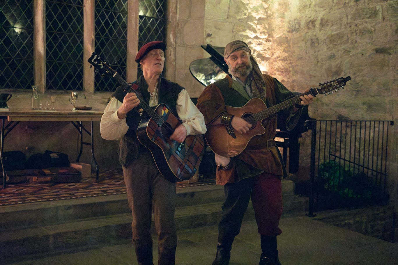 Musicians performing a song with drum and guitar