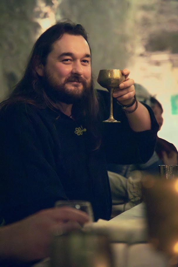 Guest raising a glass in a toast