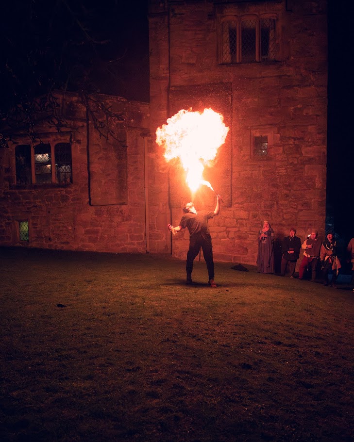 Fire dancer performing - large flame at night