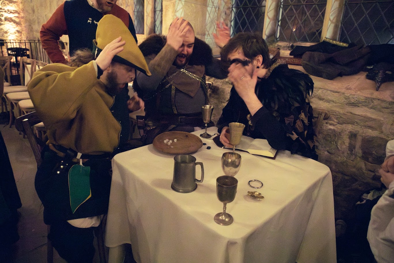 Bron playing dice at the table during the gala
